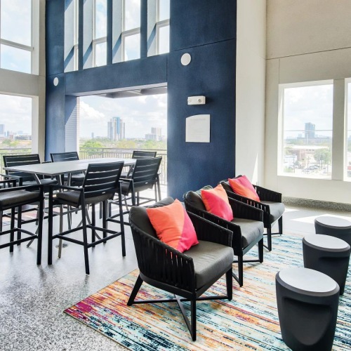 a room with a table, chairs and a couch