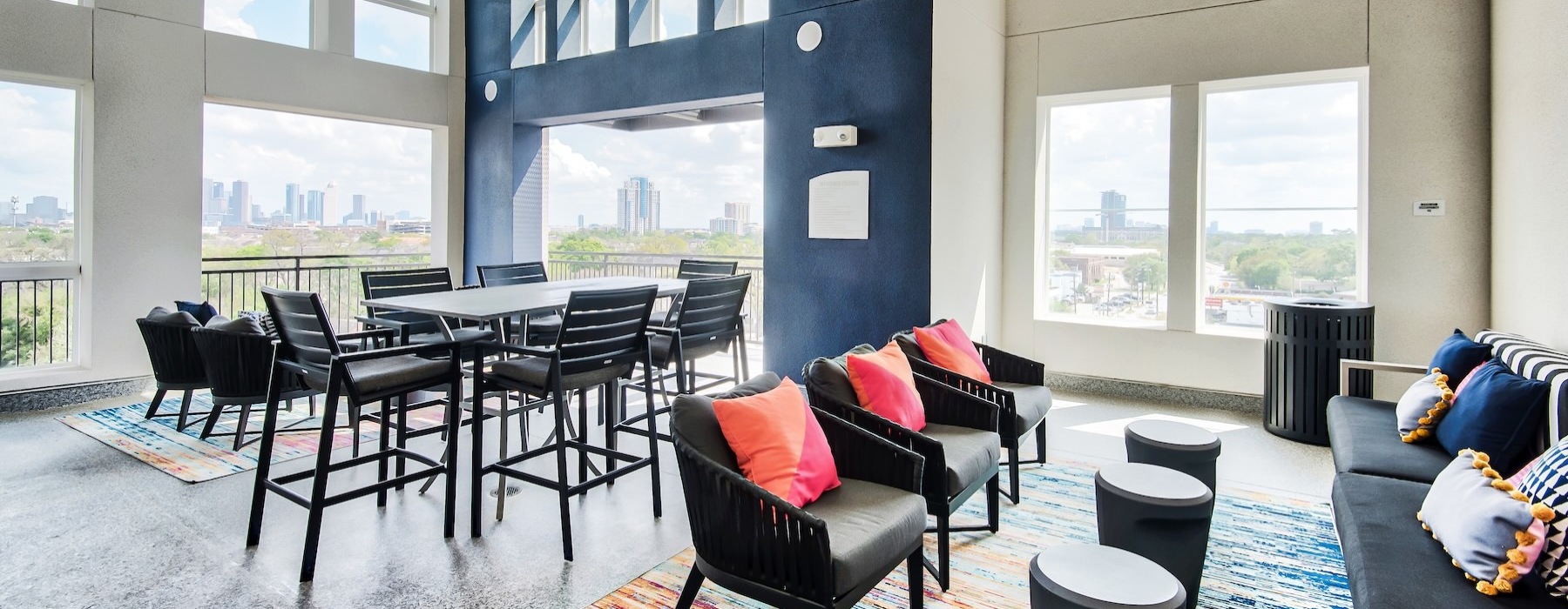 a room with a table, chairs and a couch